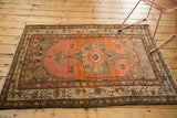 Vintage Persian Malayer rug bottom corner with abrashed apricot field and geometric ivory, charcoal borders.