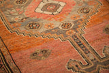 Vintage Malayer rug pile with apricot blush field, tangerine orange and charcoal border.