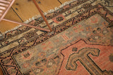 Vintage Malayer rug detail: diamond medallion, rams horn motif on abrashed apricot blush, oxidized silver.