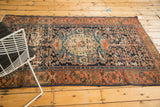 Antique Malayer rug's indigo Herati field, showing areas of wear to foundation.