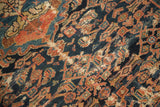 Antique Malayer rug's intricate Herati motif with indigo, madder root red, and ivory, revealing foundation wear.