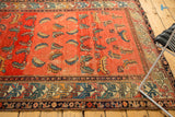 Antique Hamadan rug with unique geometric border patterns and rose, blue Mahi field motifs.