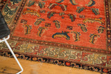 Aged blush field with floating Herati Mahi motifs and geometric border on an early 20th century Hamadan rug.