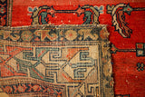Worn reverse foundation of an antique Hamadan rug, with geometric patterns and tattered edge.