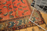 Abrashed blush field, unusual Herati Mahi motifs, and geometric border on an antique Hamadan rug.