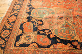 Antique Farahan Sarouk carpet detail: rich navy field with dark blush vinery and mallard green scalloped motifs.