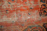 Threadbare pile and delicate floral vinery on an antique Farahan Sarouk carpet.