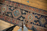 Rectilinear design with diamond motifs and lion arabesques on a Karaja runner.