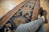 Vintage Karaja runner section highlighting lion arabesques, geometric motifs, and madder root red.