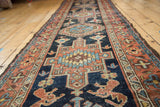 Karaja runner side shows red geometric borders and dark blue field with lion motifs.