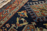 Vintage Karaja rug pile detail, with navy blue ground and geometric, hook-and-latch motifs.
