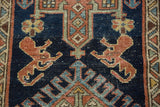 Madder root red lion arabesques and rectilinear motifs on a vintage Karaja rug.