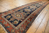 Karaja runner corner detailing lion arabesque, rectilinear drawing, and white fringe.