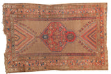 Collectible antique Caucasian rug with a camel field, blush, and navy rectilinear medallion.