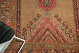 Antique Caucasian rug: rectilinear floral interpretations and mini boteh motifs.
