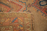Antique Caucasian rug corner showing rectilinear floral pile and its natural foundation.