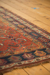 Vintage Kamseh rug border showcasing navy, madder red, gold, and Herati-inspired patterns.