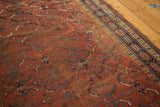 Herati-inspired pattern in madder red, blue, gold, on vintage Kamseh rug with woven border.
