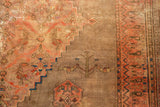 Antique Doroksh carpet: stepped corner spandrel, tree-of-life with perched birds, patterned border.