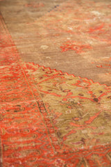 Intricate blush border and stepped contour against the antique Doroksh rug's dusty gold field.