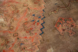 Blush floral pattern separated by a serrated border from a camel field with a perched bird.