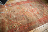 Antique Doroksh carpet corner with faded blush and gold tones, tree-of-life, and low pile.