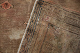 Antique Doroksh carpet detail revealing worn pile, exposed foundation, and deep blue reverse border.