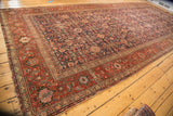 Antique Malayer runner, navy Herati field with diamond panels, wide madder red border. Circa 1900.
