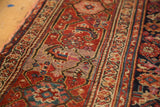 Intricate Herati motif of an antique Malayer runner in madder red, mauve, and navy.