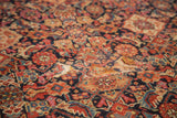 Antique Malayer runner's intricate Herati motif with a multi-toned palette and storied texture.