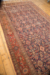 Antique Malayer rug's intricate Herati motif, diamond panels, and madder root red border.