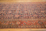 Intricate madder root red border and navy Herati pattern of an antique Malayer rug runner.