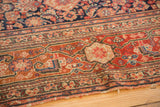 Antique Malayer rug runner's intricate madder root red border and navy Herati motifs.