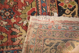 Vintage Mahal rug with red floral pile, fringed edge, and plain-woven kilim foundation.