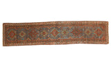 Vintage Qashqai runner with repeating sapphire blue geometric medallions and brick red borders, 2'8