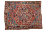 Antique Persian Heriz rug, brick red field, quatrefoil medallion, palmette motifs, jewel tones, 7'8