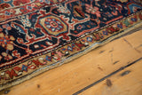 Vintage Heriz carpet with original side cord selvage and intricate floral vinery border.
