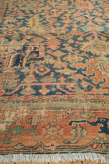 Aged pile and lower border of antique Heriz rug, with indigo, terra cotta geometric vinery and fringe.