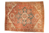 Vintage Heriz carpet, large navy medallion, faded terra cotta field, ivory geometric vinery.