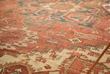 Faded madder red and ivory geometric vinery, serrated leaves on a Vintage Heriz rug.