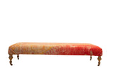 Extra Long Ottoman bench from antique Turkish rug fragment in pink, yellow, red, 74 inches.