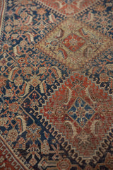 Antique Qashqai rug: finely woven indigo, wine red Herati pattern, with patina.