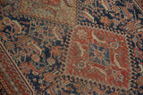 Intricate Herati and hook motif details on fine weave antique Qashqai rug in indigo and red.