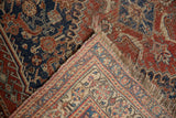 Intricate Herati pattern, hand-knotted foundation, and worn fringe on this antique Qashqai rug.