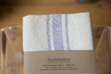 Loomination handwoven napkin, lavender and cream stripes with textured fabric and neat corner.