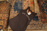 Gunpowder grey Rug Addict tank top styled on a collection of vintage rugs.