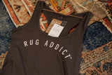 Close view of the racerback straps showing the organic cotton and brand tags.