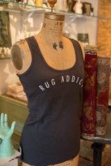 The 'Rug Addict' gunpowder grey tank top showing its form-fitting, racerback cut.
