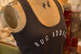 Angled view of the Gunpowder tank top showing the white 'Rug Addict' text.