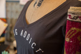 Detail of the soft, heathered Gunpowder fabric and white graphic on the women's V-neck.